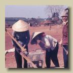 Image25 - Wonder what this stuff tastes like?
Note the tents in background with sand bags were the first sleeping quarters Image25